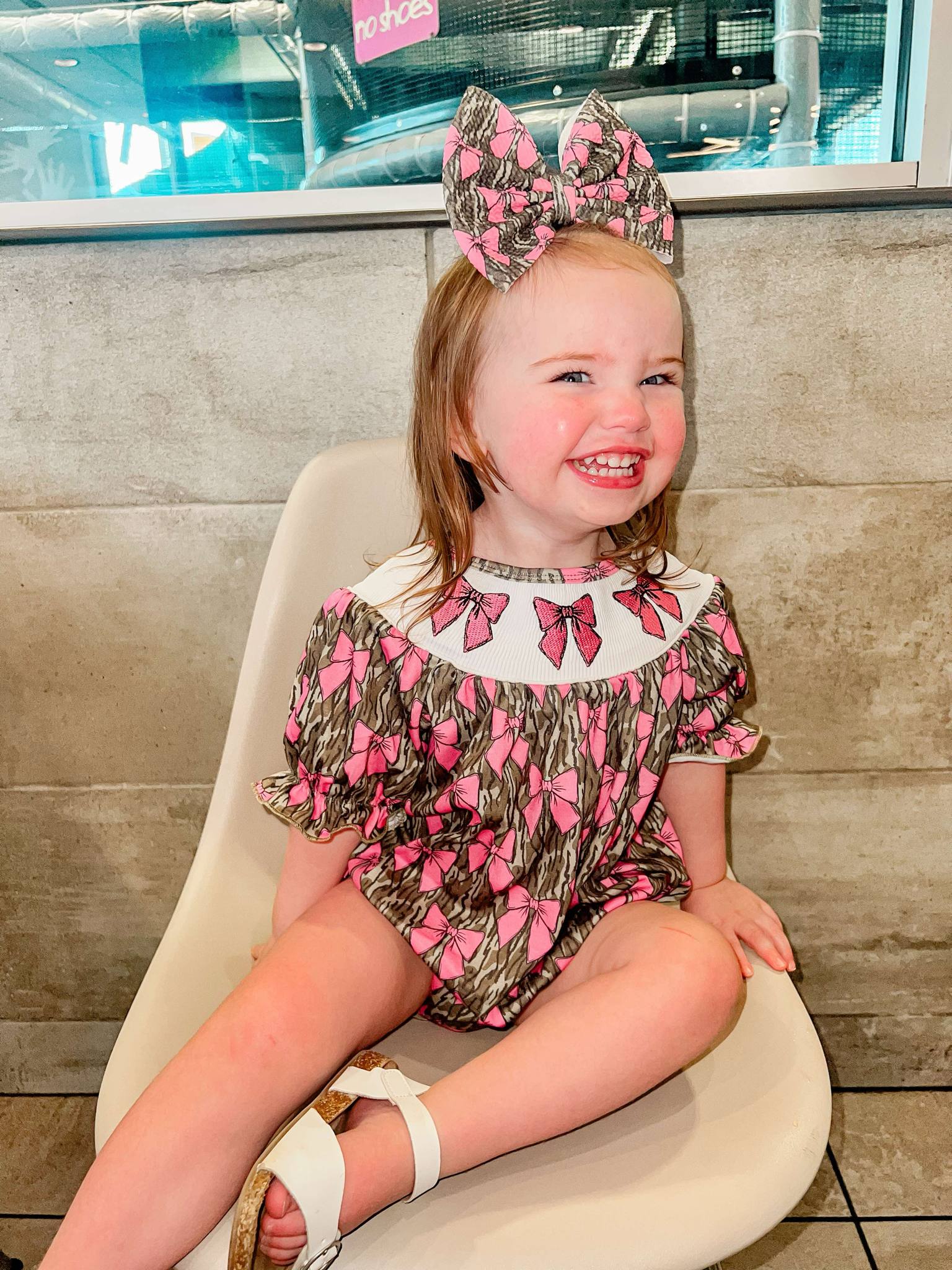 Smocked camo bows romper